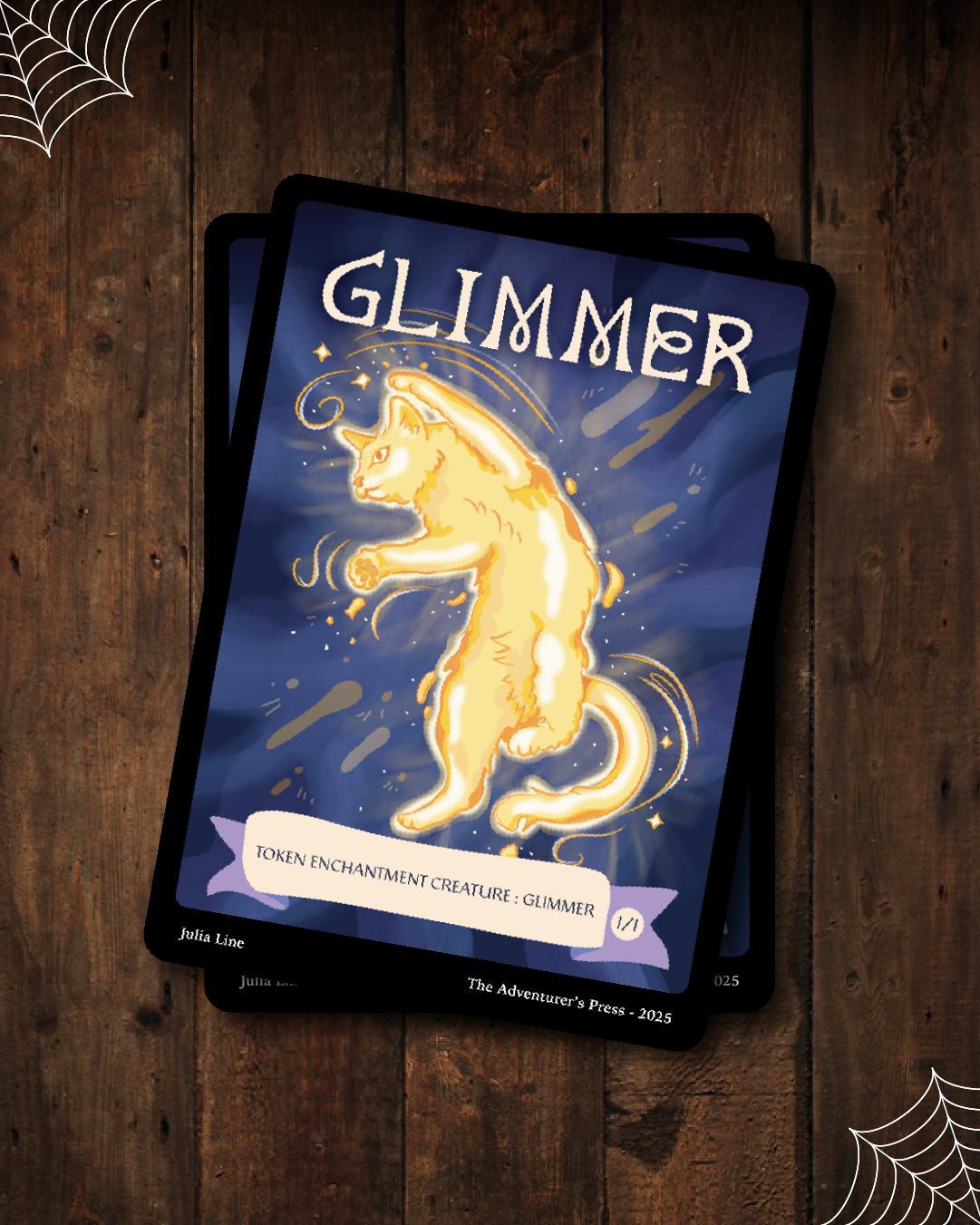 Glimmer Token card with a cat illustration on a wooden surface