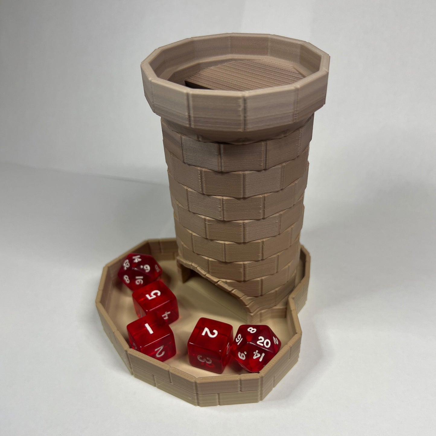 Dice tower holding dice in sandstone color